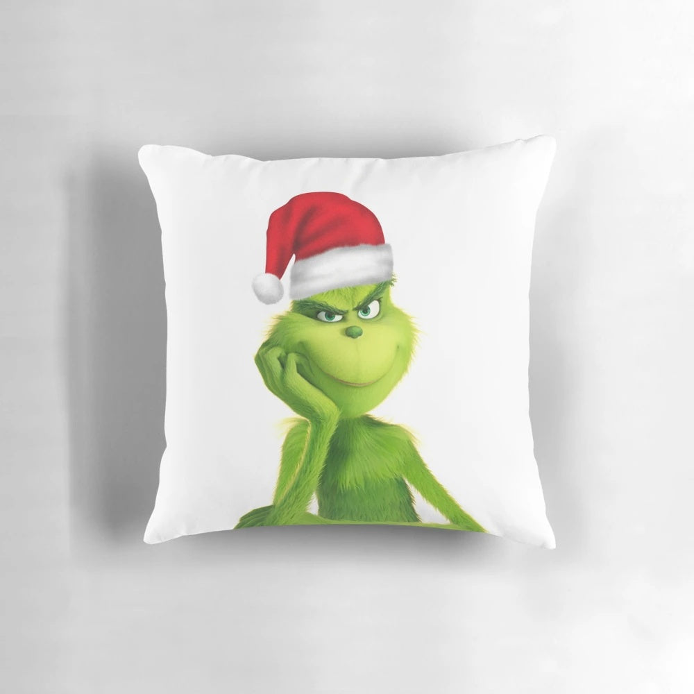 Soft, cuddly Grinch plush pillow perfect for Christmas and holiday decor