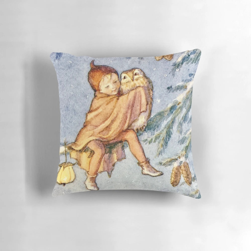 A festive Christmas pillow featuring a charming owl design by renowned artist Margaret Tarrant.