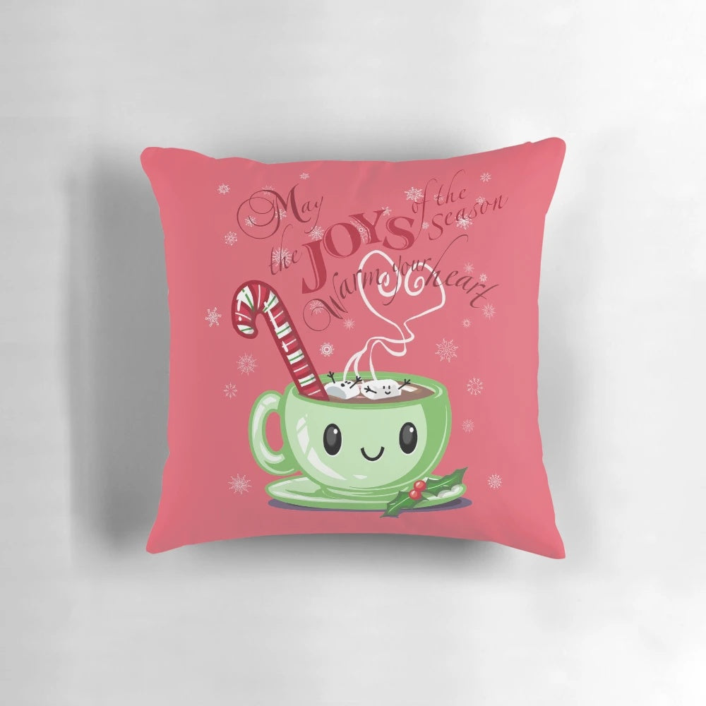 Cozy Christmas-themed pillow featuring hot chocolate, candy canes, and festive decorations