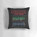 A colorful and festive Christmas pillow featuring an ugly sweater-inspired design.