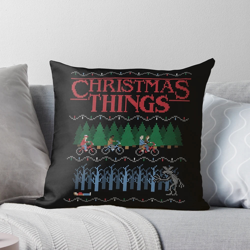 A colorful and festive Christmas pillow featuring an ugly sweater-inspired design.