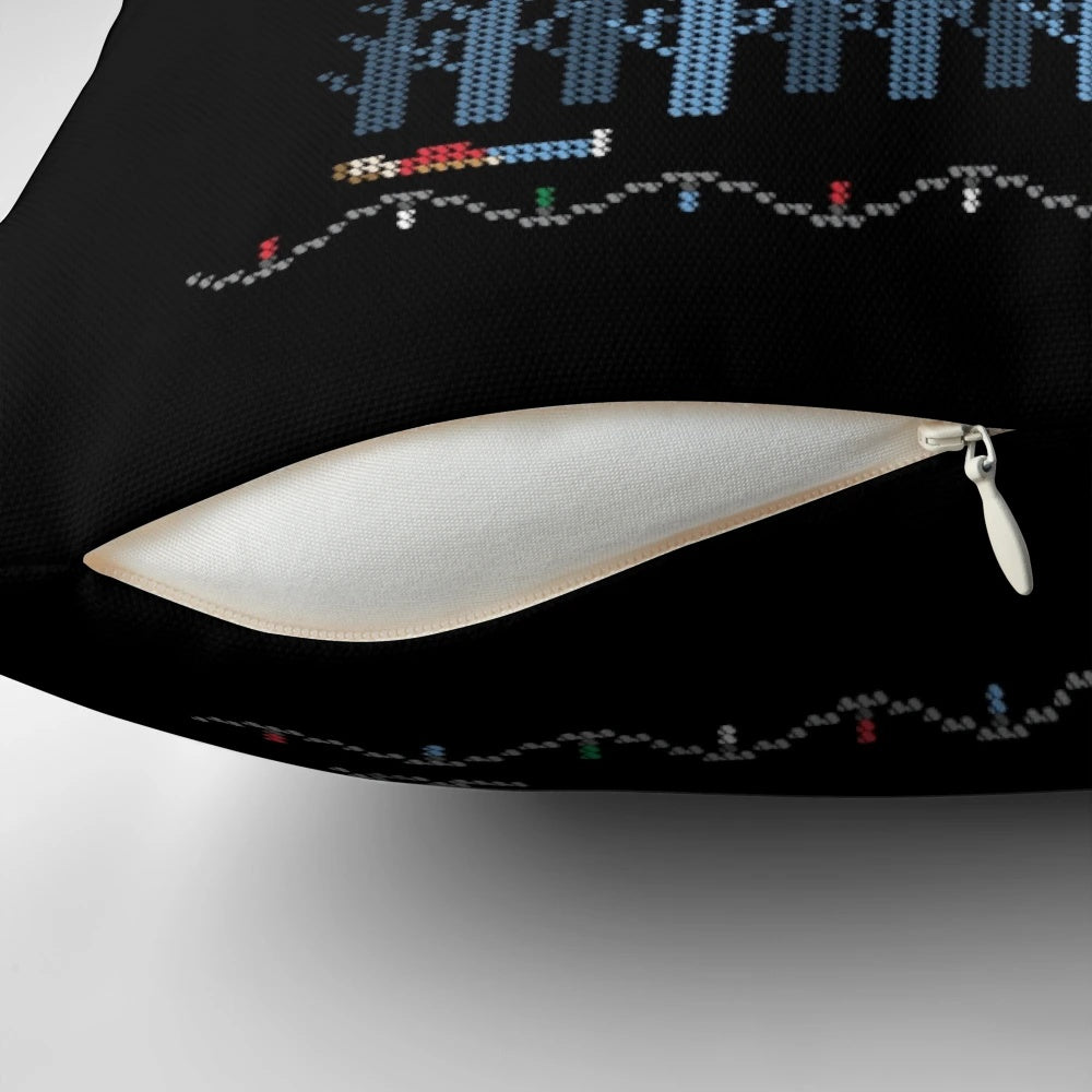 A colorful and festive Christmas pillow featuring an ugly sweater-inspired design.