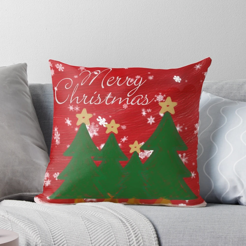 Adorable Christmas-themed pillow with a hand-drawn design of snowflakes, Christmas trees, and holiday sweaters