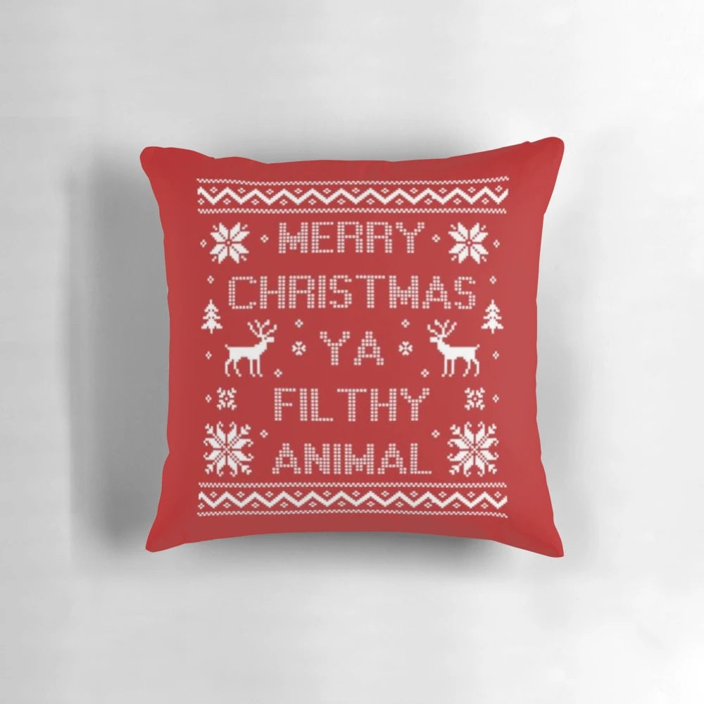 Soft, plush Christmas pillow featuring the quote "Merry Christmas ya filthy animal" from the popular holiday film Home Alone.
