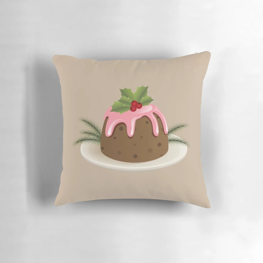 Soft, plush Christmas pudding-shaped pillow with holly berries and pink icing, perfect for holiday decor.