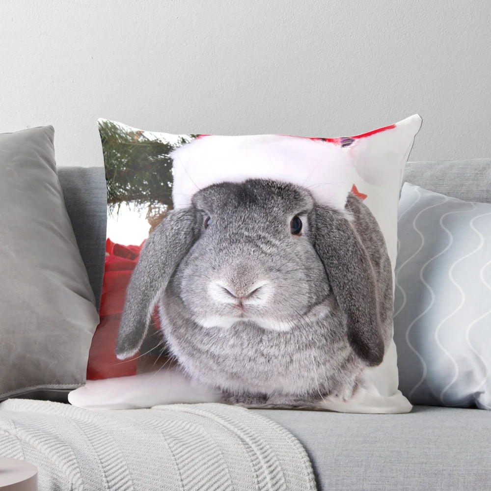 A soft, plush pillow in the shape of a Christmas rabbit, with festive decorations and a warm, fuzzy appearance.