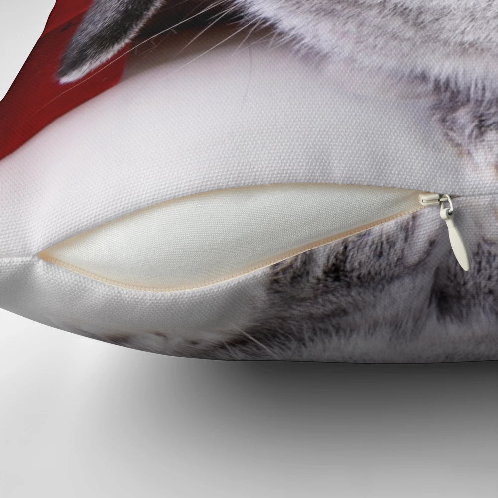 A soft, plush pillow in the shape of a Christmas rabbit, with festive decorations and a warm, fuzzy appearance.