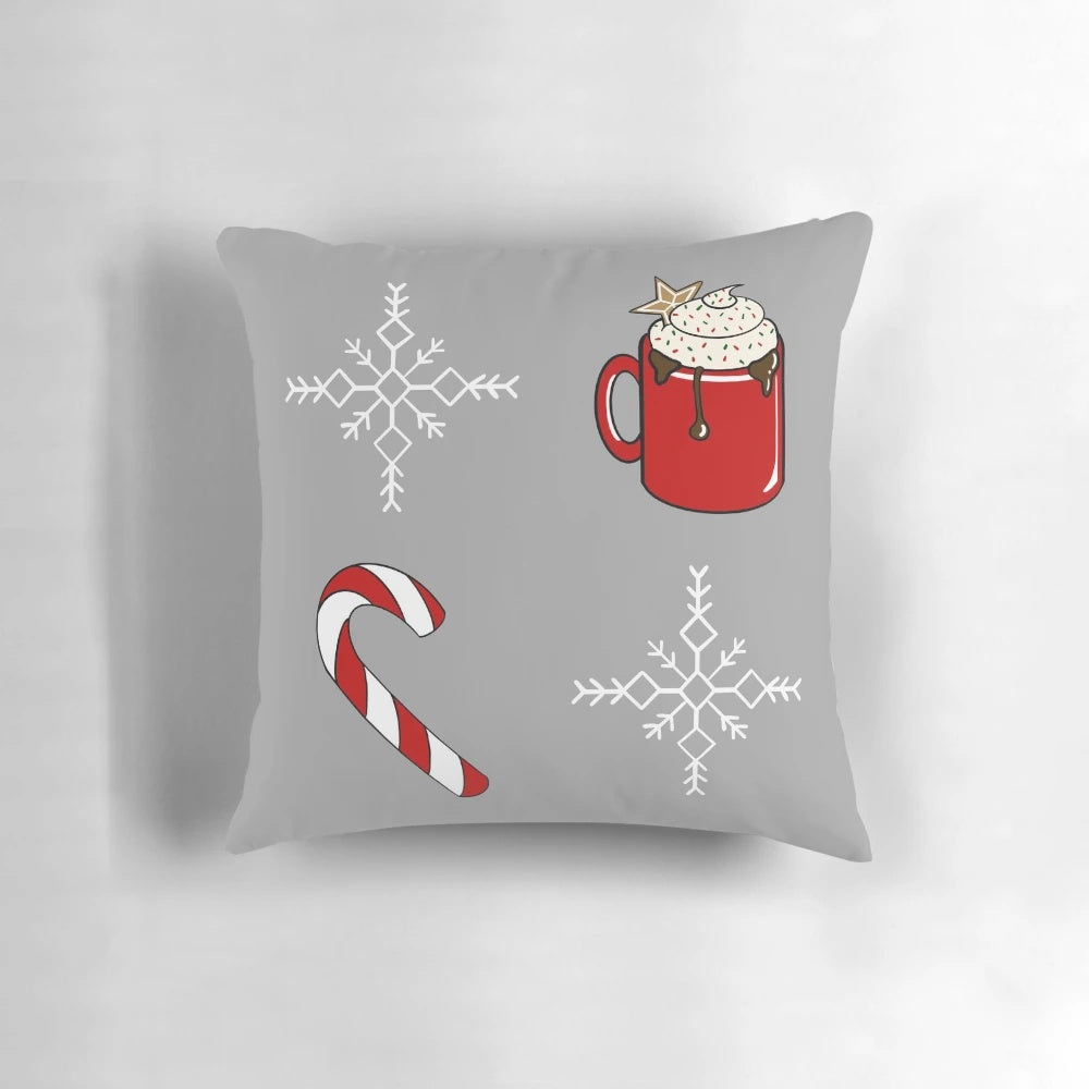 Soft, plush Christmas-themed pillow with candy canes, snowflakes, and gingerbread details