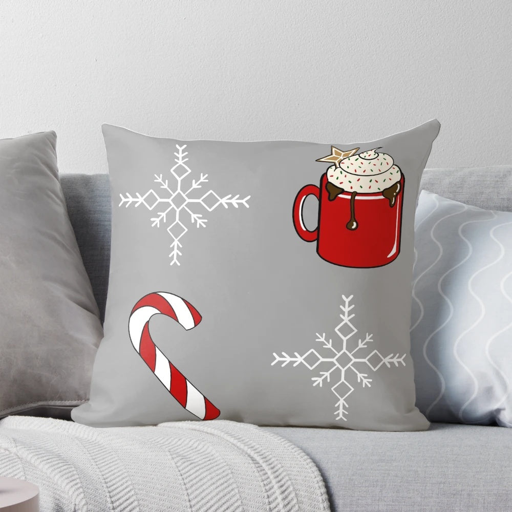 Soft, plush Christmas-themed pillow with candy canes, snowflakes, and gingerbread details
