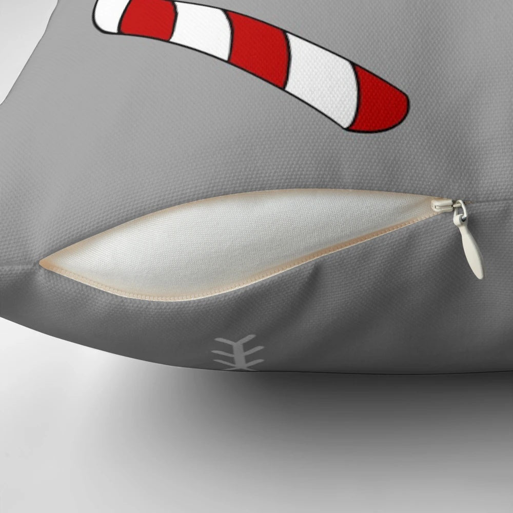 Soft, plush Christmas-themed pillow with candy canes, snowflakes, and gingerbread details