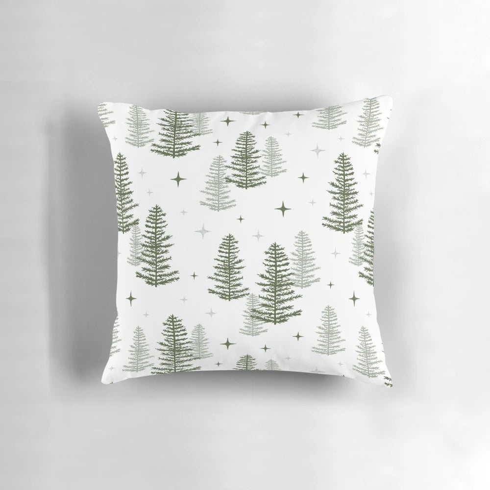 A cozy Christmas throw pillow featuring a minimalist design of a winter forest scene with trees, a star, and a warm, neutral color palette.