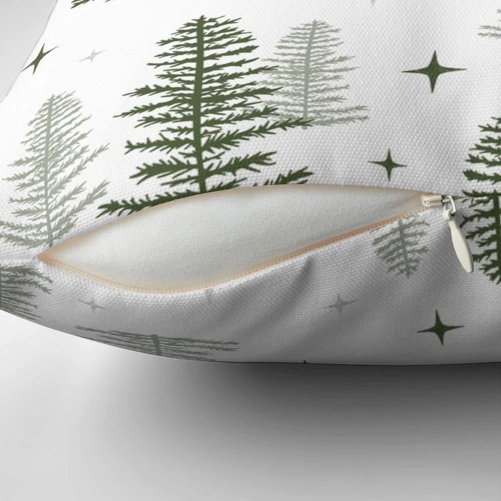 A cozy Christmas throw pillow featuring a minimalist design of a winter forest scene with trees, a star, and a warm, neutral color palette.
