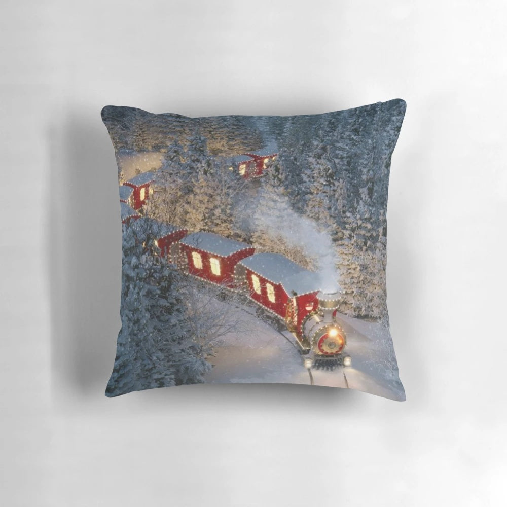 A soft, plush Christmas train pillow with a festive holiday design featuring Santa, the North Pole, and the Polar Express.