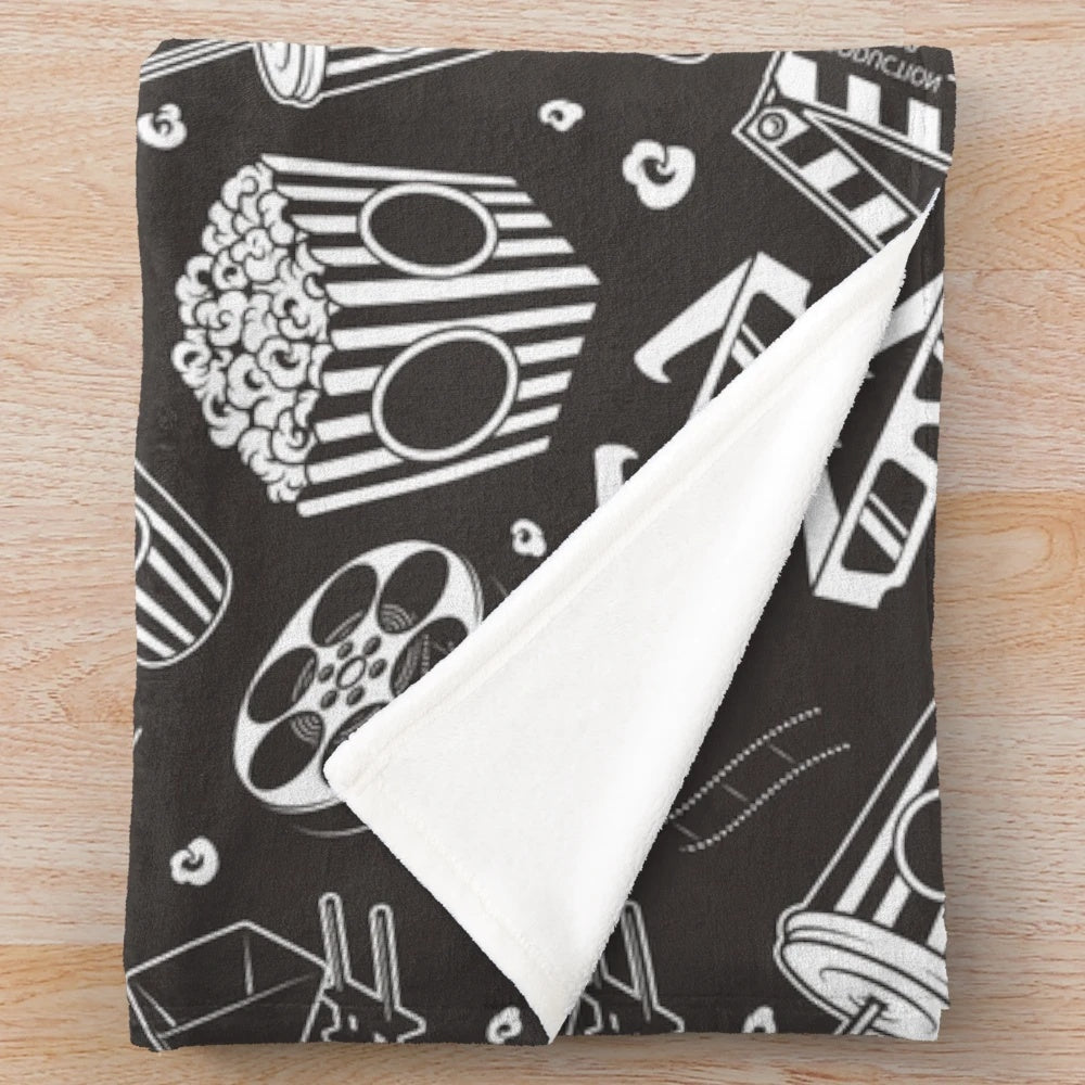 Plush blanket with retro movie-themed design