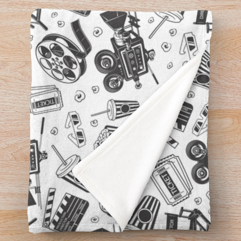 Cinema-themed plush blanket with seamless pattern including movie elements