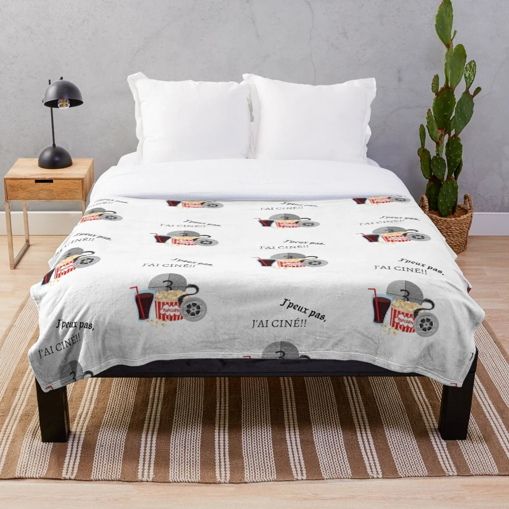 Plush movie-themed blanket featuring classic cinema elements