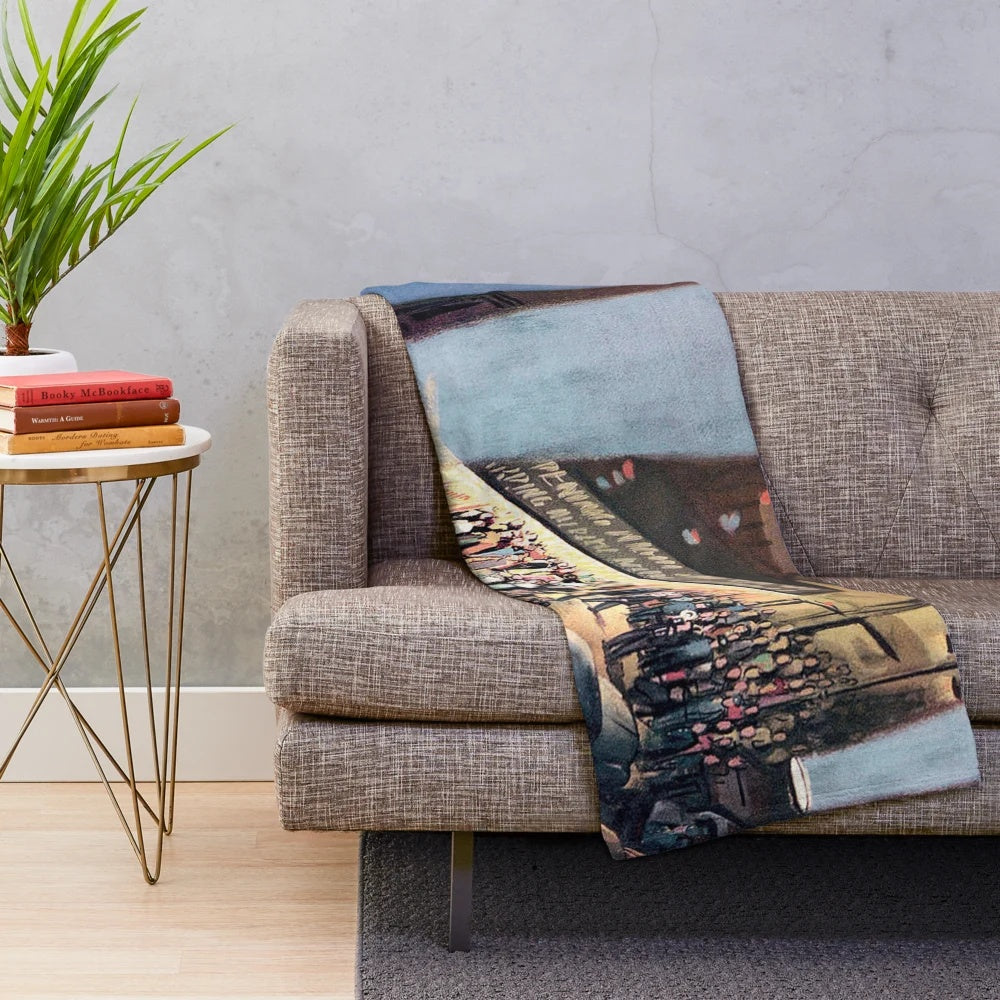 Closeup of a soft, plush blanket with a cinema or theater-themed design