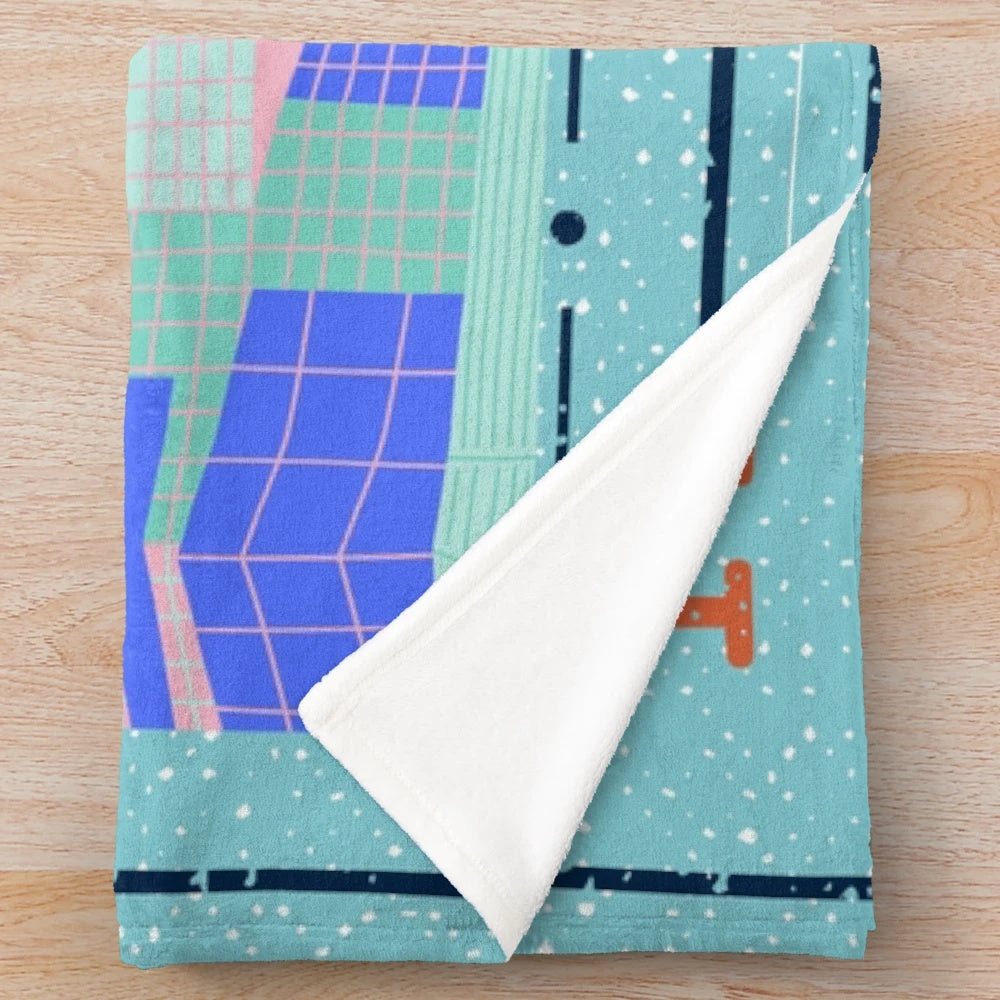 Soft and plush cinema-themed blanket with blue ticket design and pink building backdrop