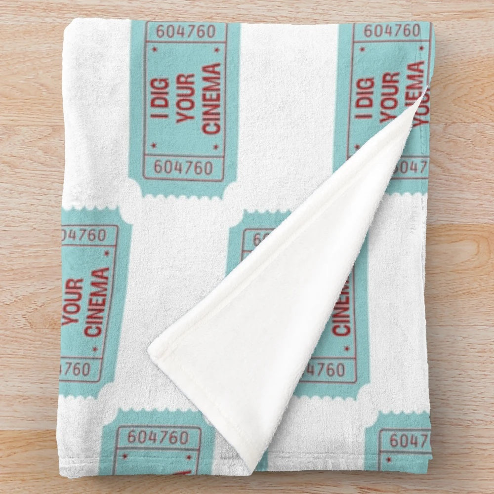 Plush blanket featuring a cinema-inspired design, ideal for movie and book enthusiasts