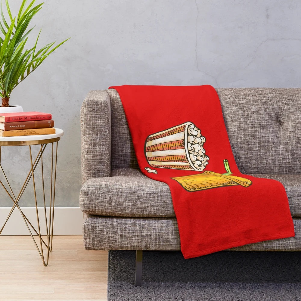 Plush blanket featuring an illustration of cinema popcorn and soda