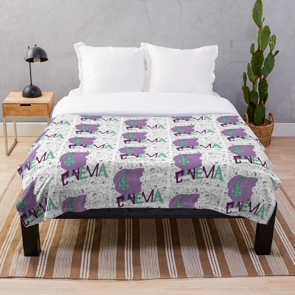 Cinema-themed plush blanket with seamless movie pattern design