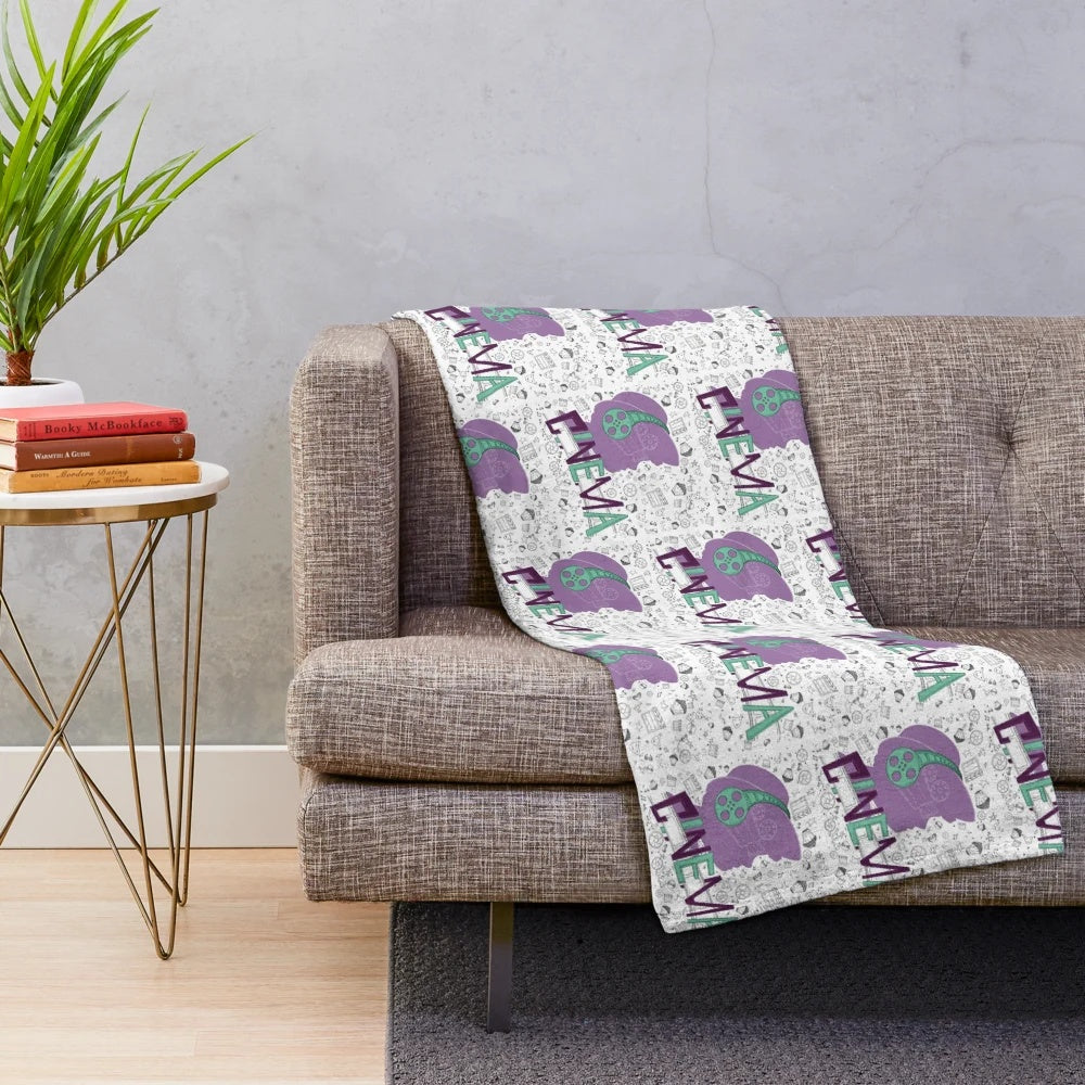 Cinema-themed plush blanket with seamless movie pattern design