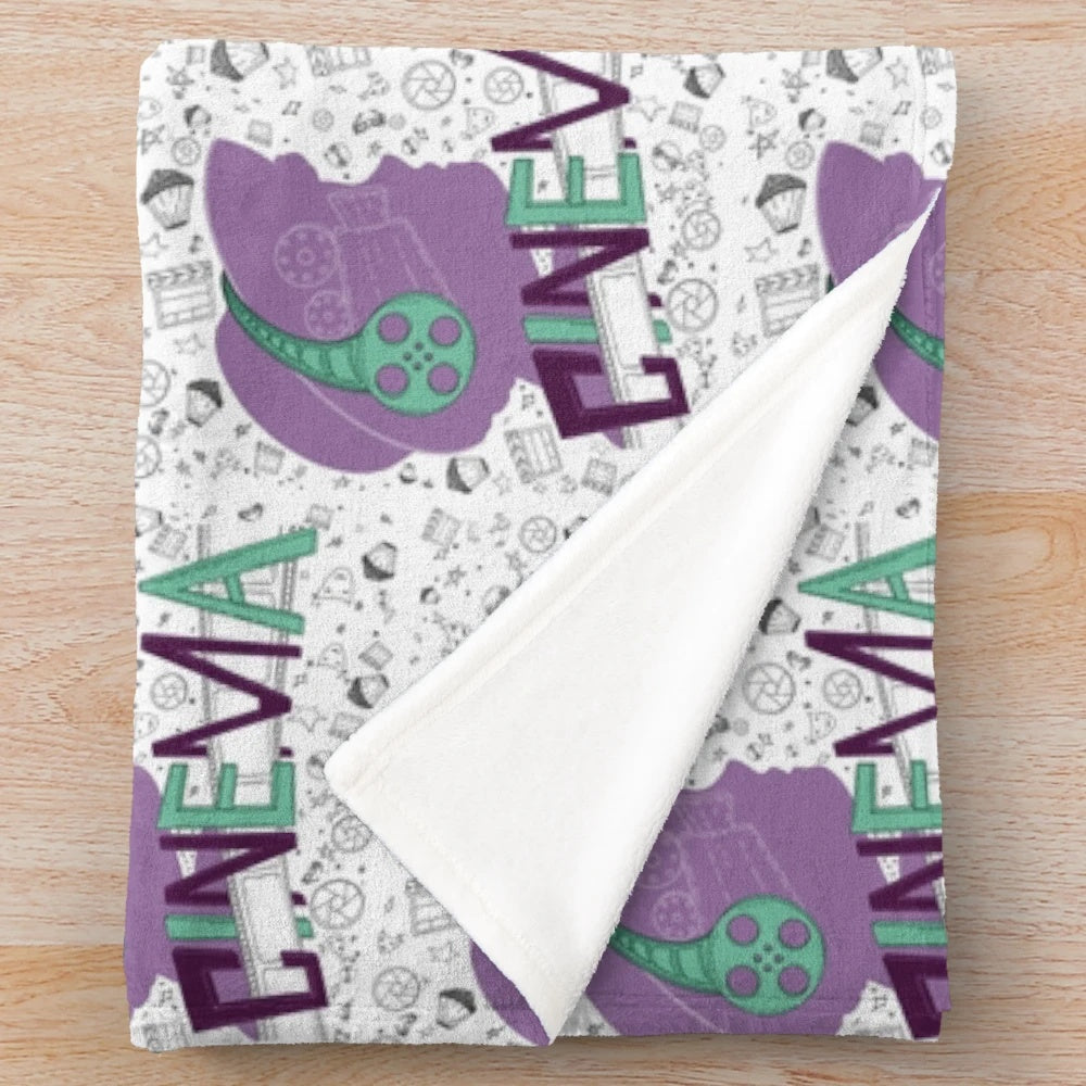 Cinema-themed plush blanket with seamless movie pattern design