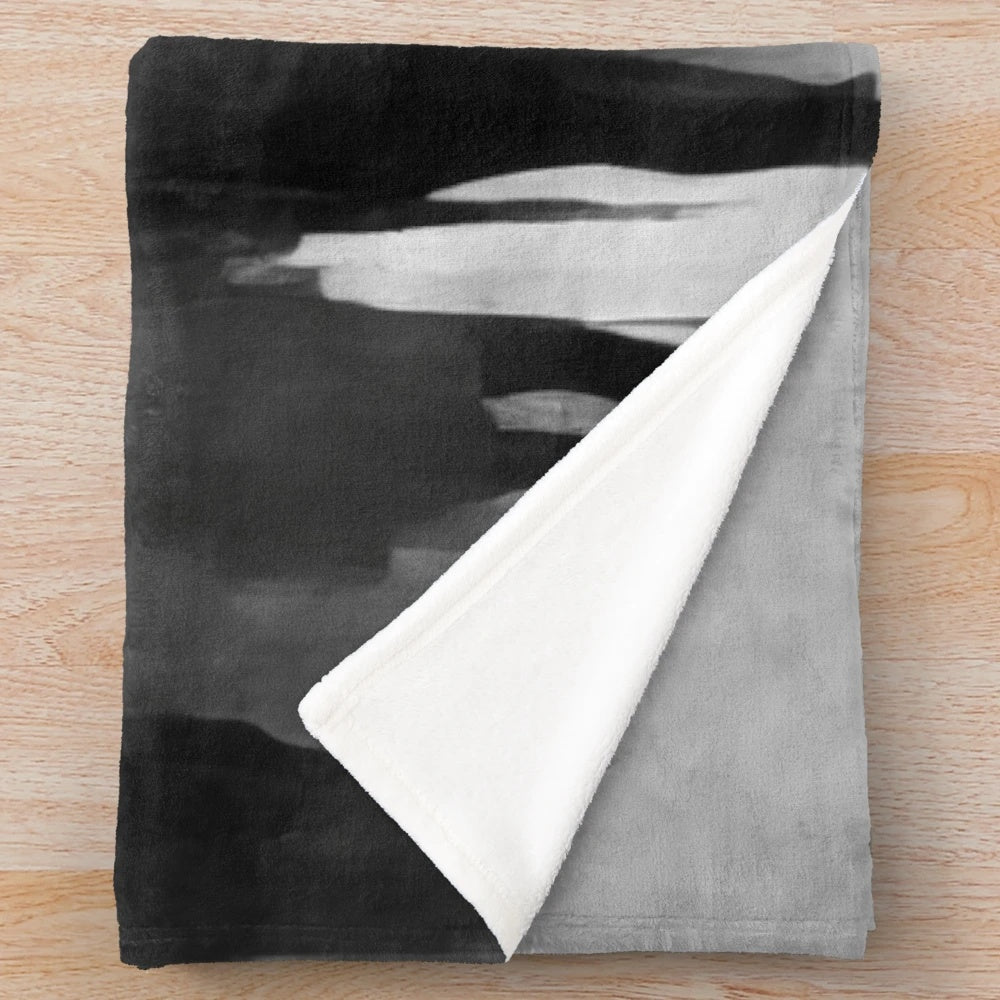 Cinema-themed plush blanket with abstract crowd in black and white