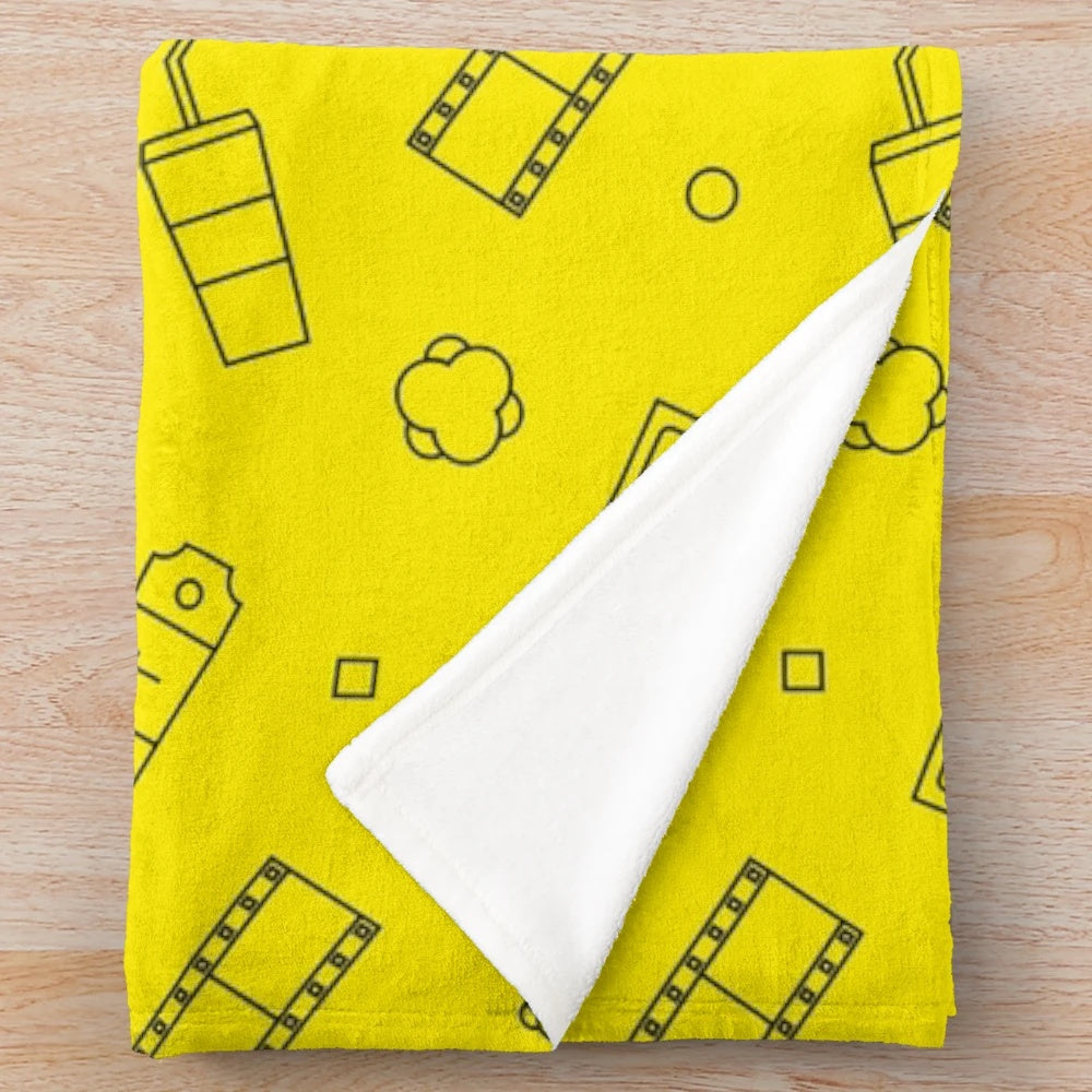 A plush, cozy blanket with a film or movie-inspired print design