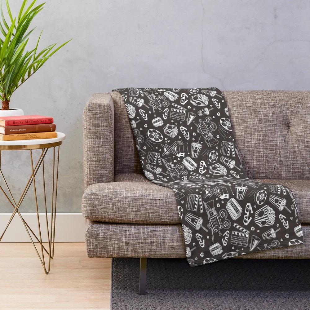 Cinema-themed plush blanket with seamless repeating pattern