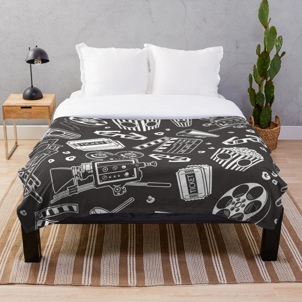 Cozy plush blanket with a cinema-inspired seamless pattern design