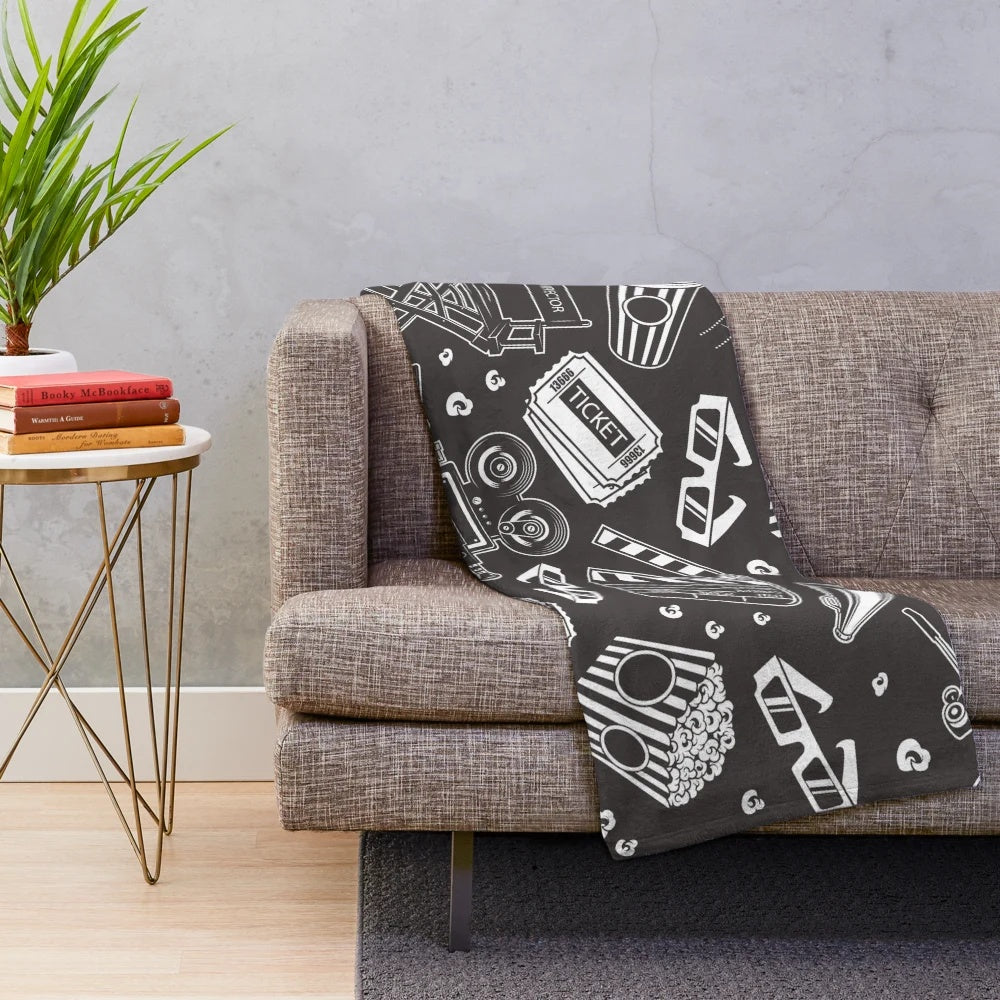 Cozy plush blanket with a cinema-inspired seamless pattern design