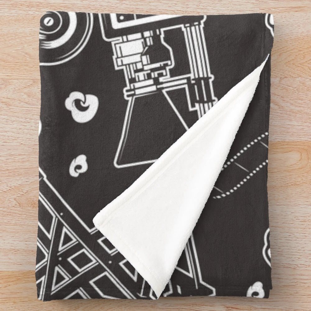 Cozy plush blanket with a cinema-inspired seamless pattern design