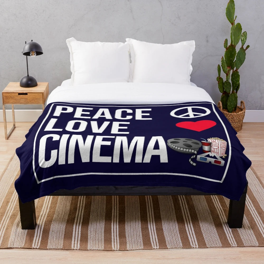 Plush blanket with "Peace Love Cinema" design, perfect for cinema fans