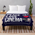 Plush blanket with "Peace Love Cinema" design, perfect for cinema fans
