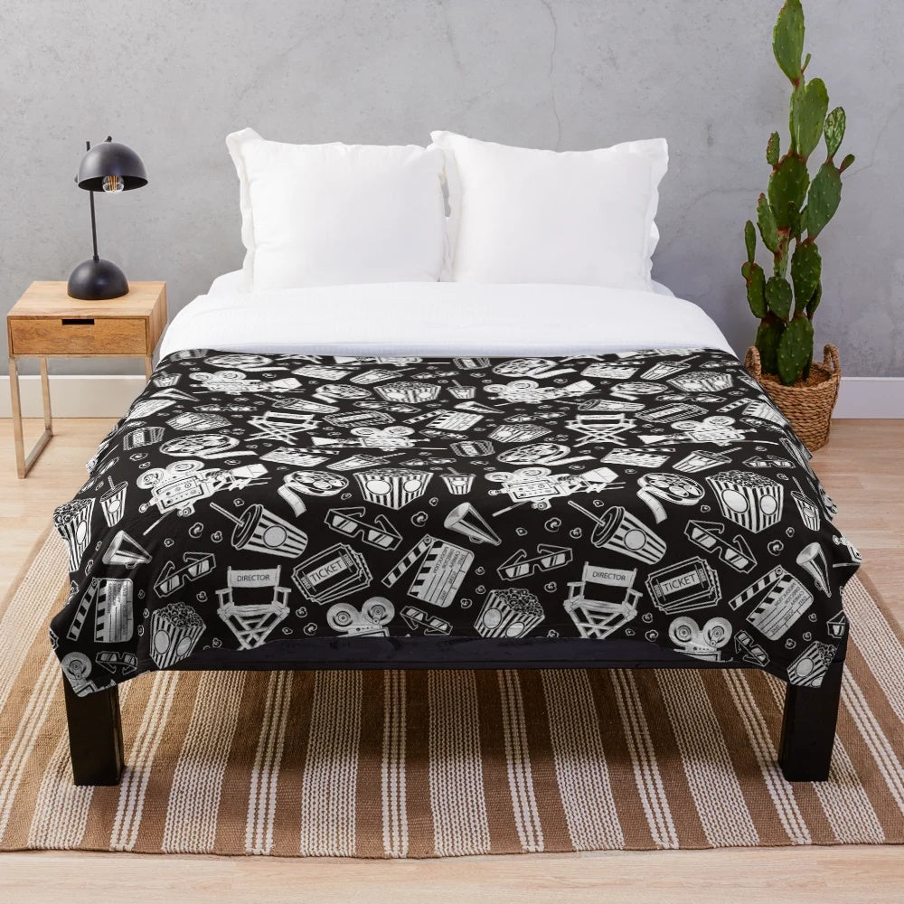 Cinema pattern plush blanket with white background and black design
