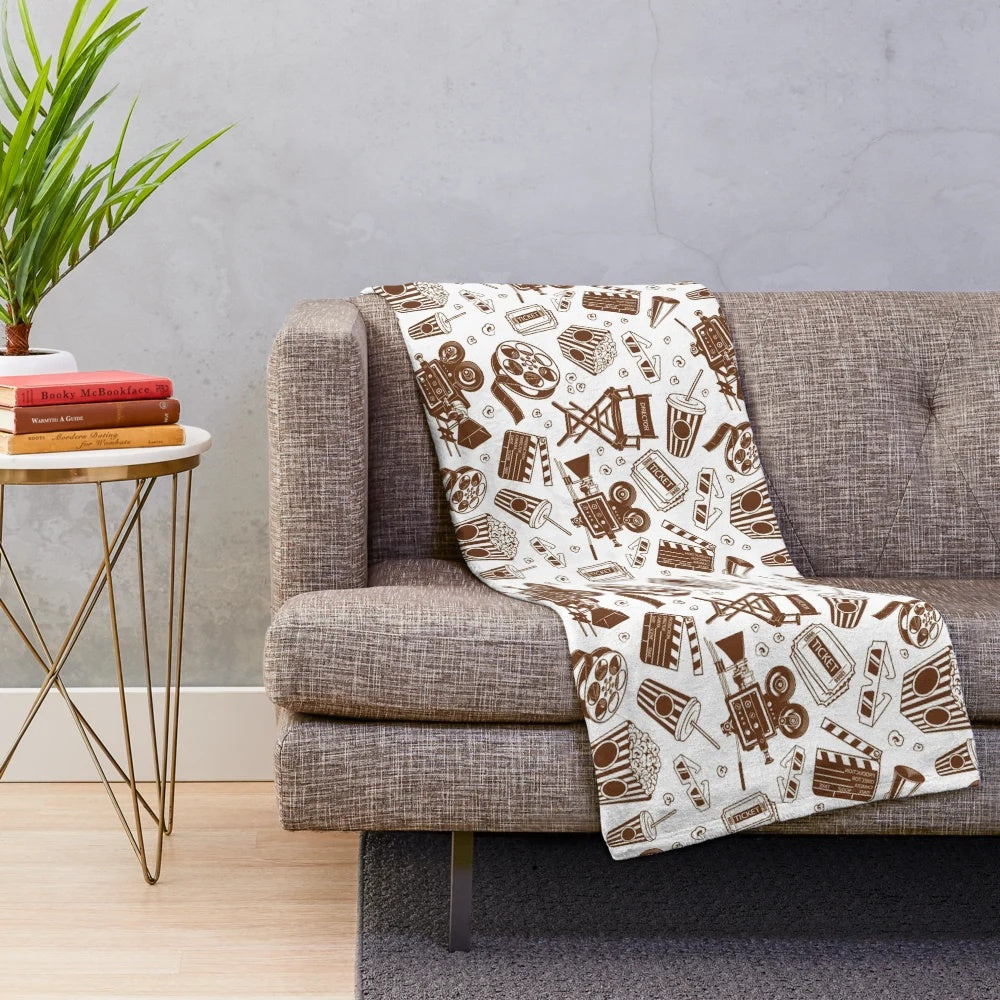 Sepia and black plush blanket with a cinema pattern design