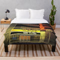 Cozy CINEMA plush blanket featuring movie-themed design