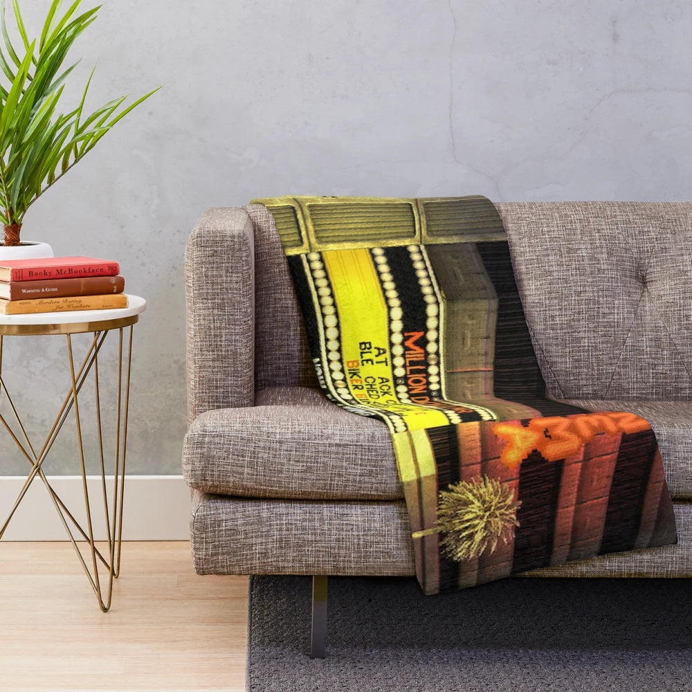 Cozy CINEMA plush blanket featuring movie-themed design