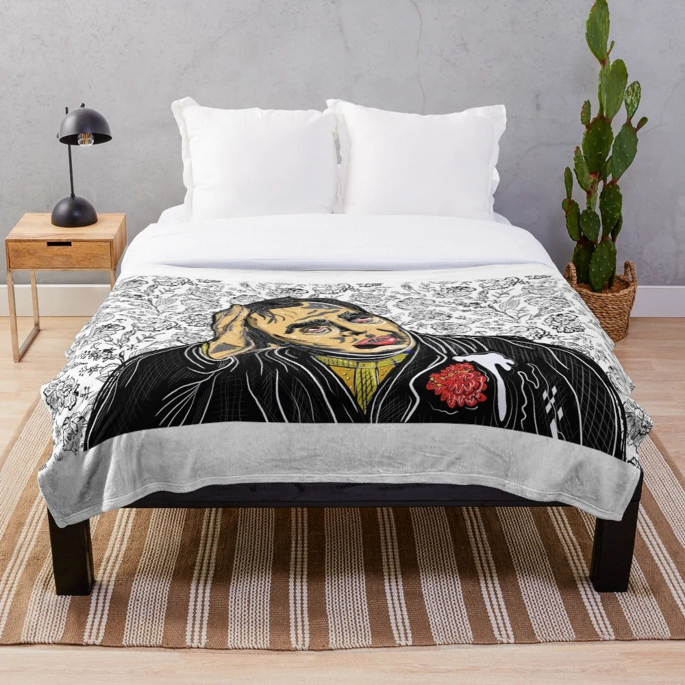 A soft and plush blanket featuring a cinema or movie themed design