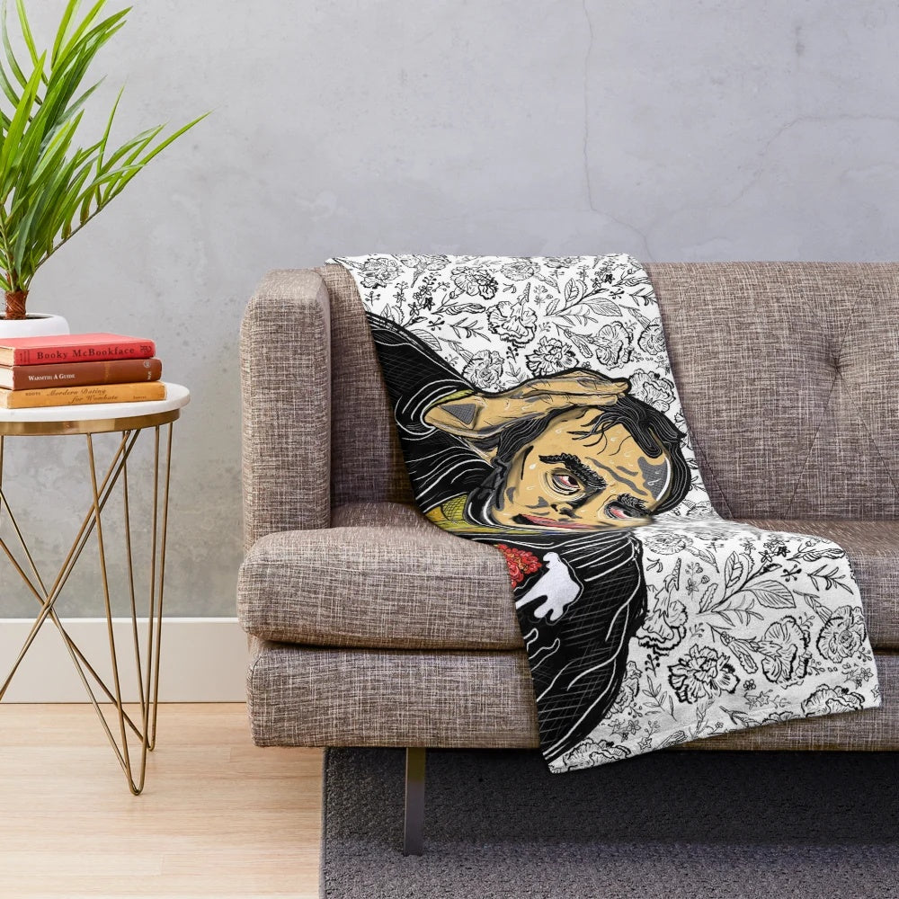 A soft and plush blanket featuring a cinema or movie themed design