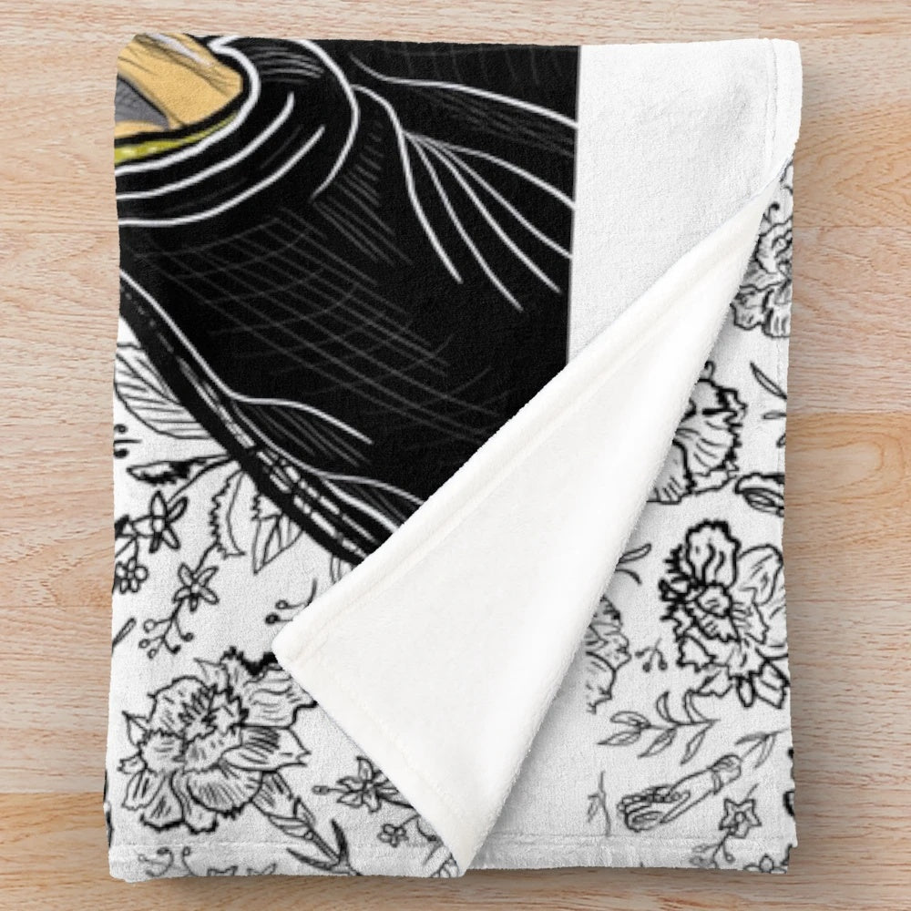 A soft and plush blanket featuring a cinema or movie themed design