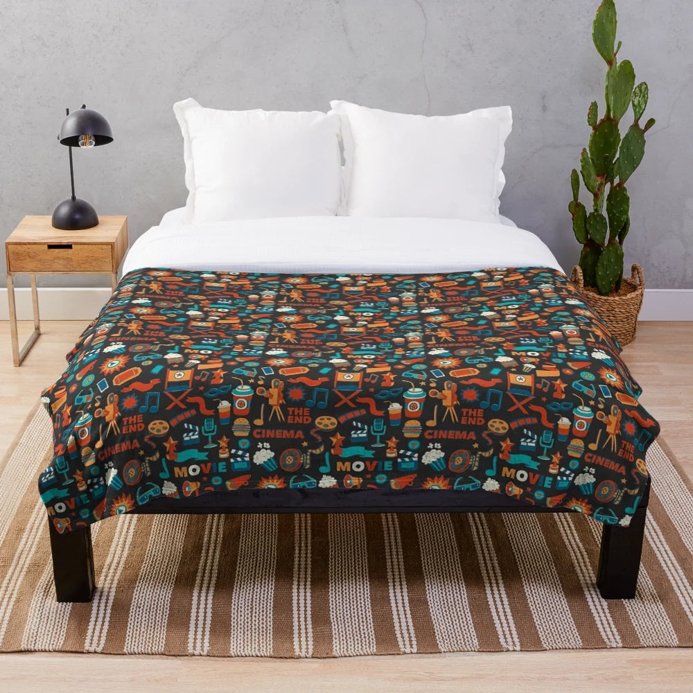Plush blanket with movie theater and cinema-inspired design