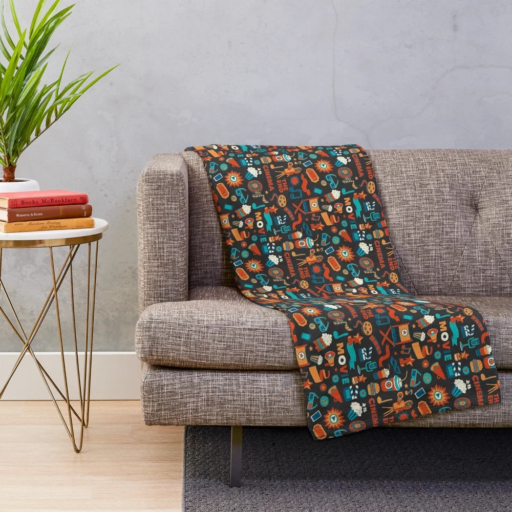 Plush blanket with movie theater and cinema-inspired design