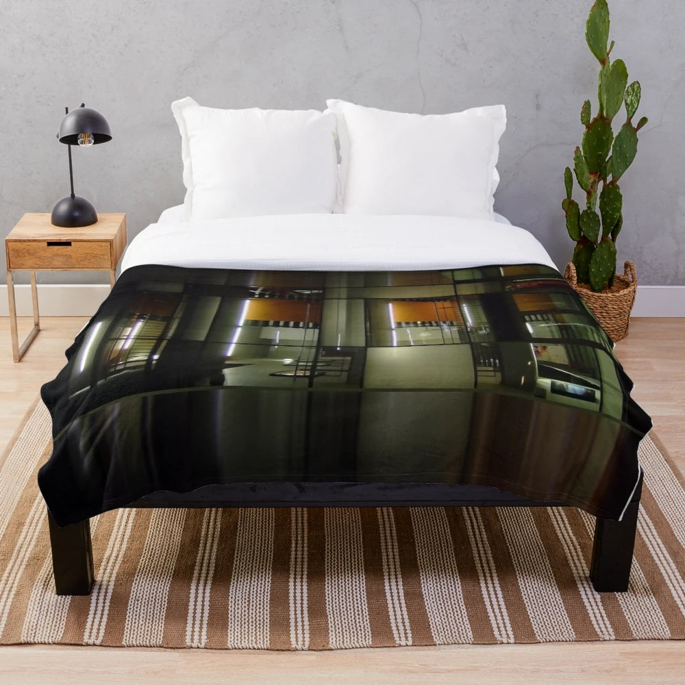 Cozy cinema-themed plush blanket with abstract lines and colors