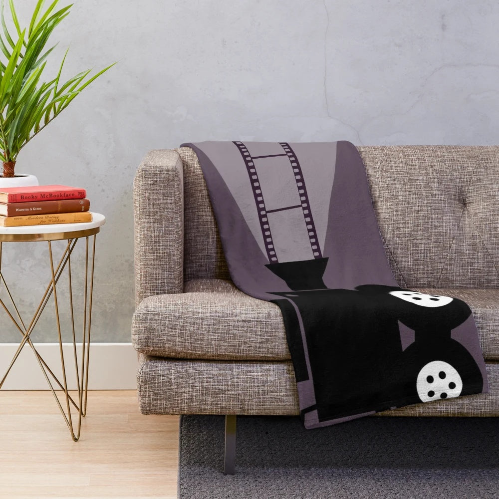 Cinema-themed plush blanket with a soft, cozy texture