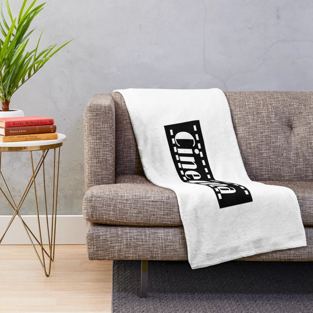 Soft and plush cinema-themed blanket with a black and white movie design