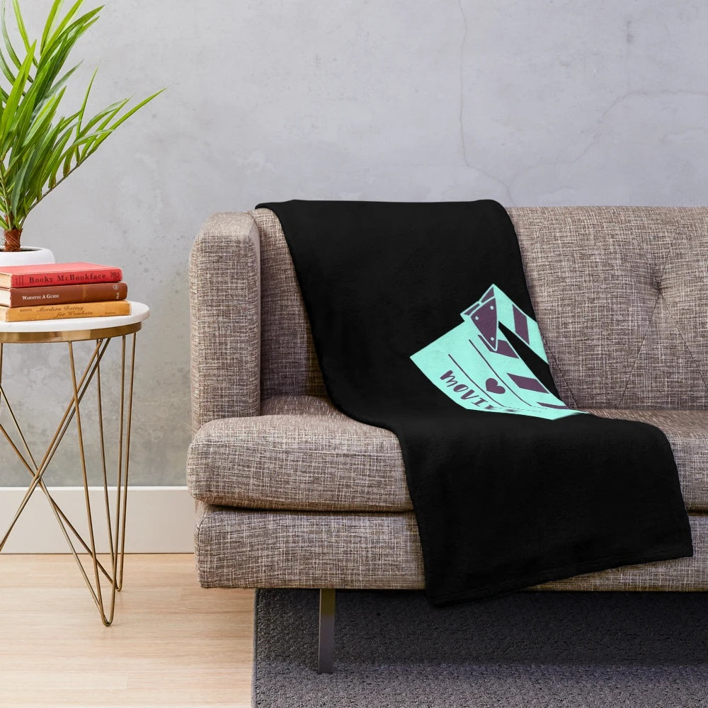 Plush cinema-themed blanket with movie clapperboard design