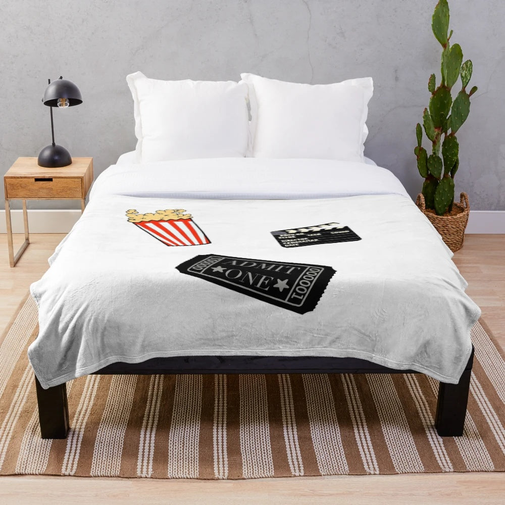 Plush cinema-themed blanket with movie production elements
