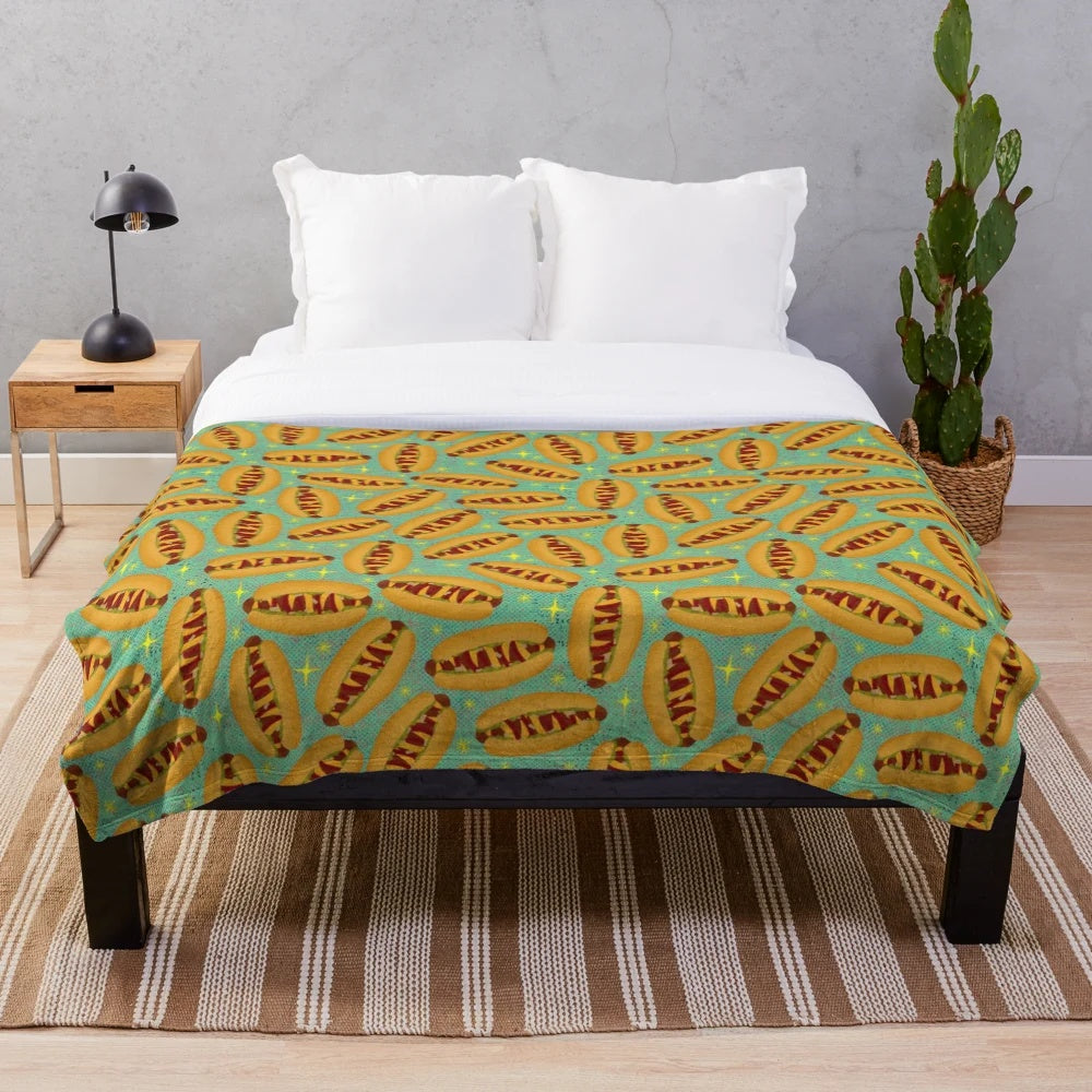Plush blanket featuring a retro-style hot dog design, perfect for movie nights and nostalgic vibes.